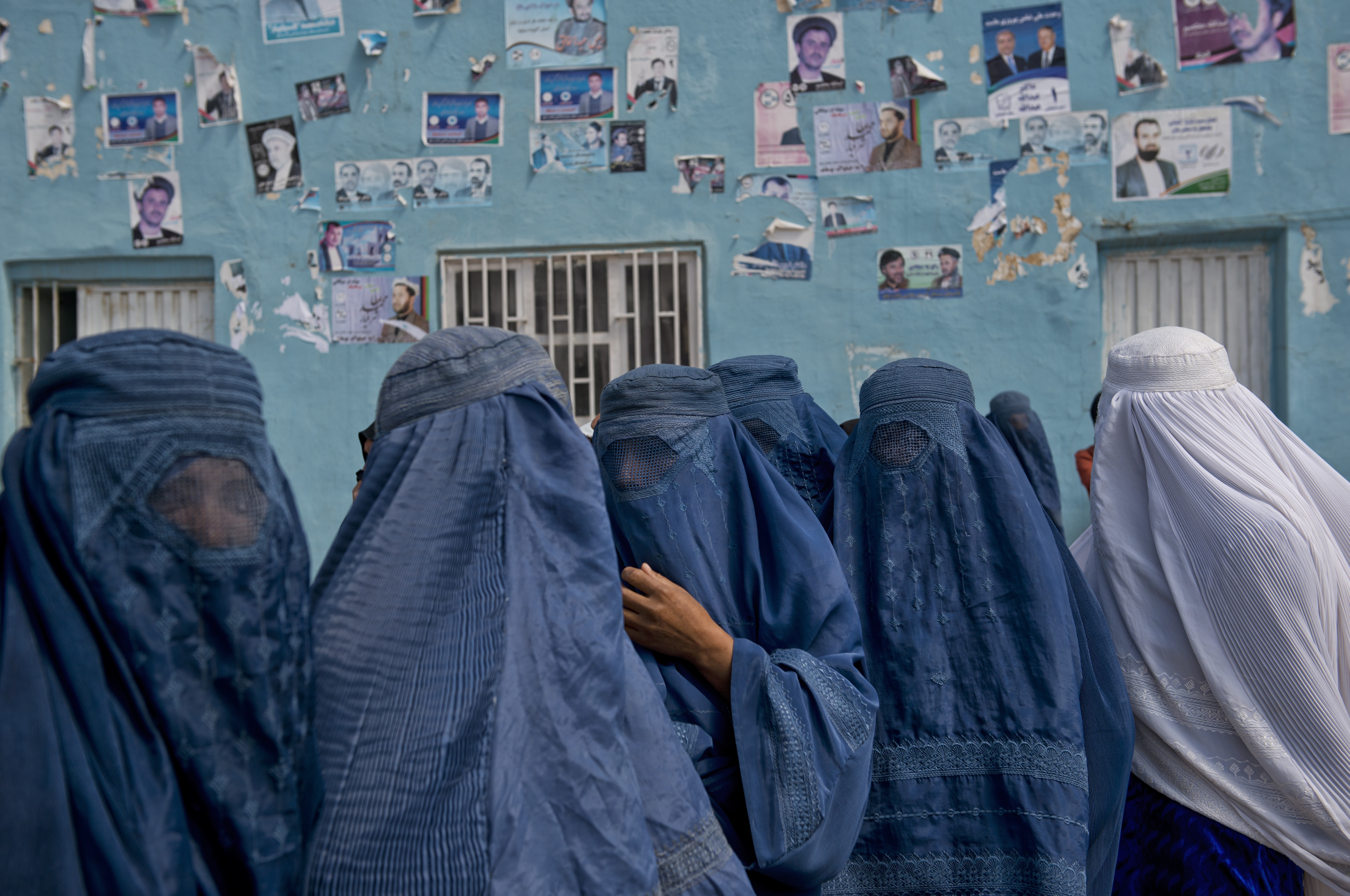 Afghan women leave a rally for Presidential candidate Dr. Zalmay Rassoul and Vice Presidential candidate Habiba Sourabi, in a stadium in Mazar-e-Sharif, Afghanistan