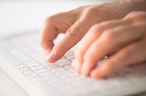 close-up-hands-typing-keyboard