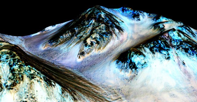 In this handout provided by NASA's Mars Reconnaissance Orbiter, dark, narrow streaks on the slopes of Hale Crater are inferred to be formed by seasonal flow of water on surface of present-day Mars.
