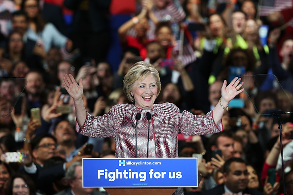 Democratic presidential candidate Hillary Clinton walks on stage with her husband Bill Clinton after winning the highly contested New York primary on April 19, 2016 in New York City.