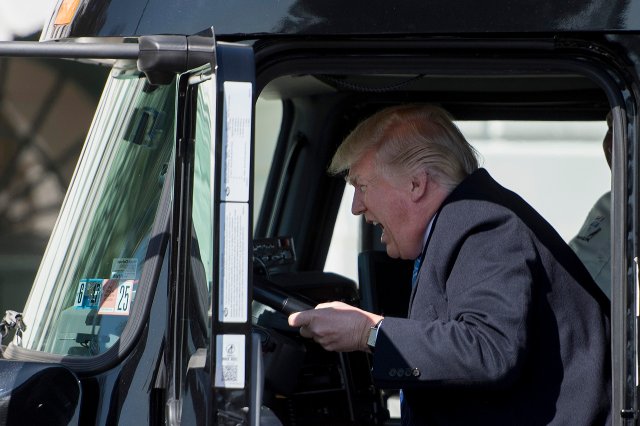 President Donald Trump posed in drivers seat of a semi-truck as he welcomes truckers and CEOs to the White House to discuss healthcare on, March 23, 2017.