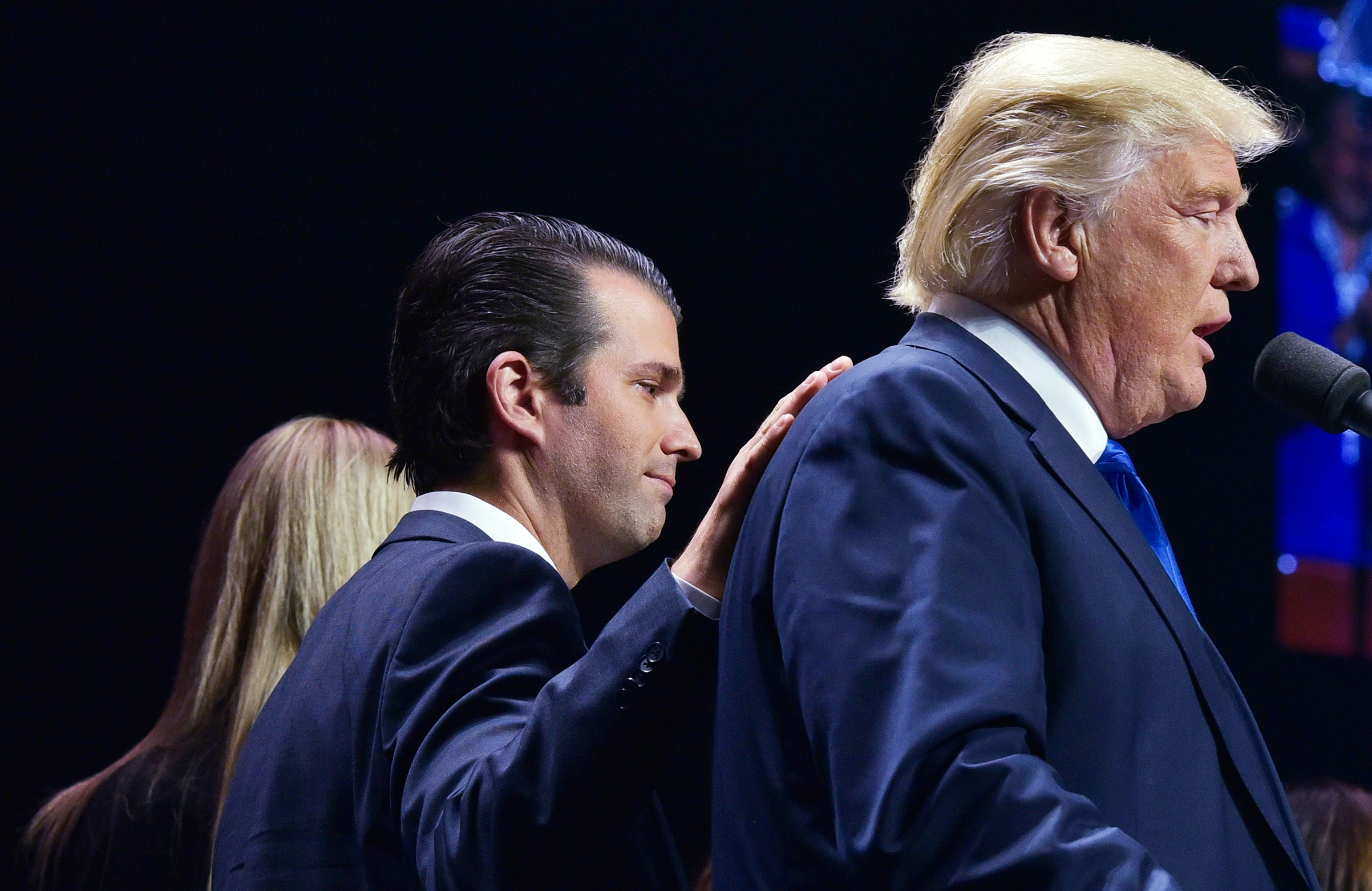 Father and son attend a rally in Manchester, N.H., on Nov. 7, 2016, the eve of the election.