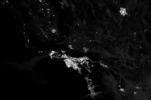 Powerful Santa Ana winds fueled a fast-moving fire that swept into Ventura, California, on December 5, 2017. After burning for roughly one day, the blaze had charred 50,000 acres (20,000 hectares), destroyed at least 150 structures, and forced more than 27,000 people to evacuate.The Visible Infrared Imaging Radiometer Suite (VIIRS) on the Suomi NPP satellite captured this nighttime image of the fire at 1:05 a.m. local time (09:05 Universal Time) on December 5, 2017. For comparison, the second image was acquired the night before at 1:25 a.m. local time (09:25 Universal Time).Turn on the image-comparison tool to see the fires brighten the rural landscape north of Ventura. The fire was imaged by a special “day-night band” that detects light in a range of wavelengths from green to near-infrared and uses light intensification to detect dim signals.ReferencesCal Fire (2017, December 5) Thomas Fire. Accessed December 5, 2017.CIMSS Satellite Blog (2015, December 5) Wildfires in southern California. Accessed December 5, 2017.Los Angeles Times (2017, December 5) Ventura wildfire rages over 45,500 acres, destroys more than 150 structures, triggers evacuation of 27,000. Accessed December 5, 2017.Los Angeles Times (2015, October 29) Infographic Where do the Santa Ana winds come from? Accessed December 5, 2017.NASA Earth Observatory images by Joshua Stevens using VIIRS day-night band data from the Suomi National Polar-orbiting Partnership. Caption by Adam Voiland.Instrument(s): Suomi NPP - VIIRS