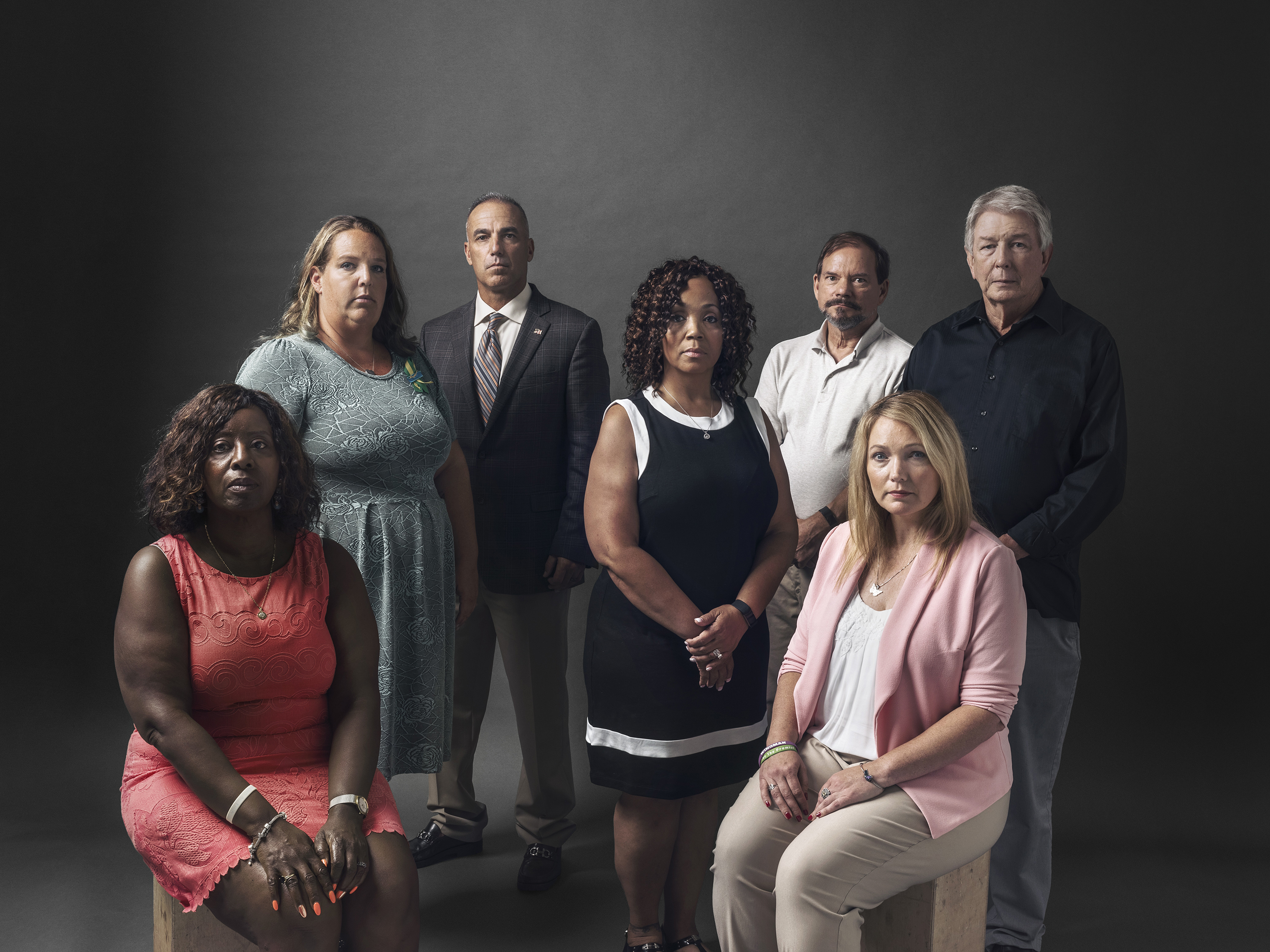 Seven parents of seven dead students. From left: Pamela Wright- Young, Melissa Willey, Andrew Pollack, Darshell Scott, Tom Mauser, Nicole Hockley and Darrell Scott