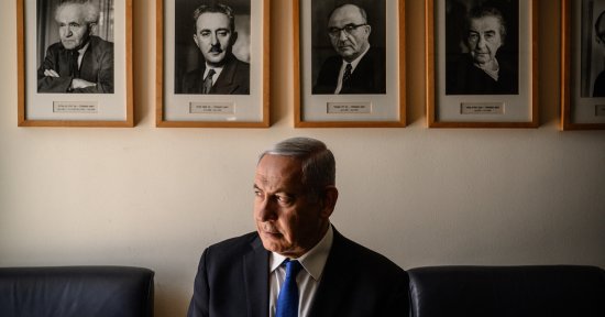 Netanyahu in his Jerusalem office, with portraits of Israel’s early Prime Ministers, starting with David Ben-Gurion, top left.