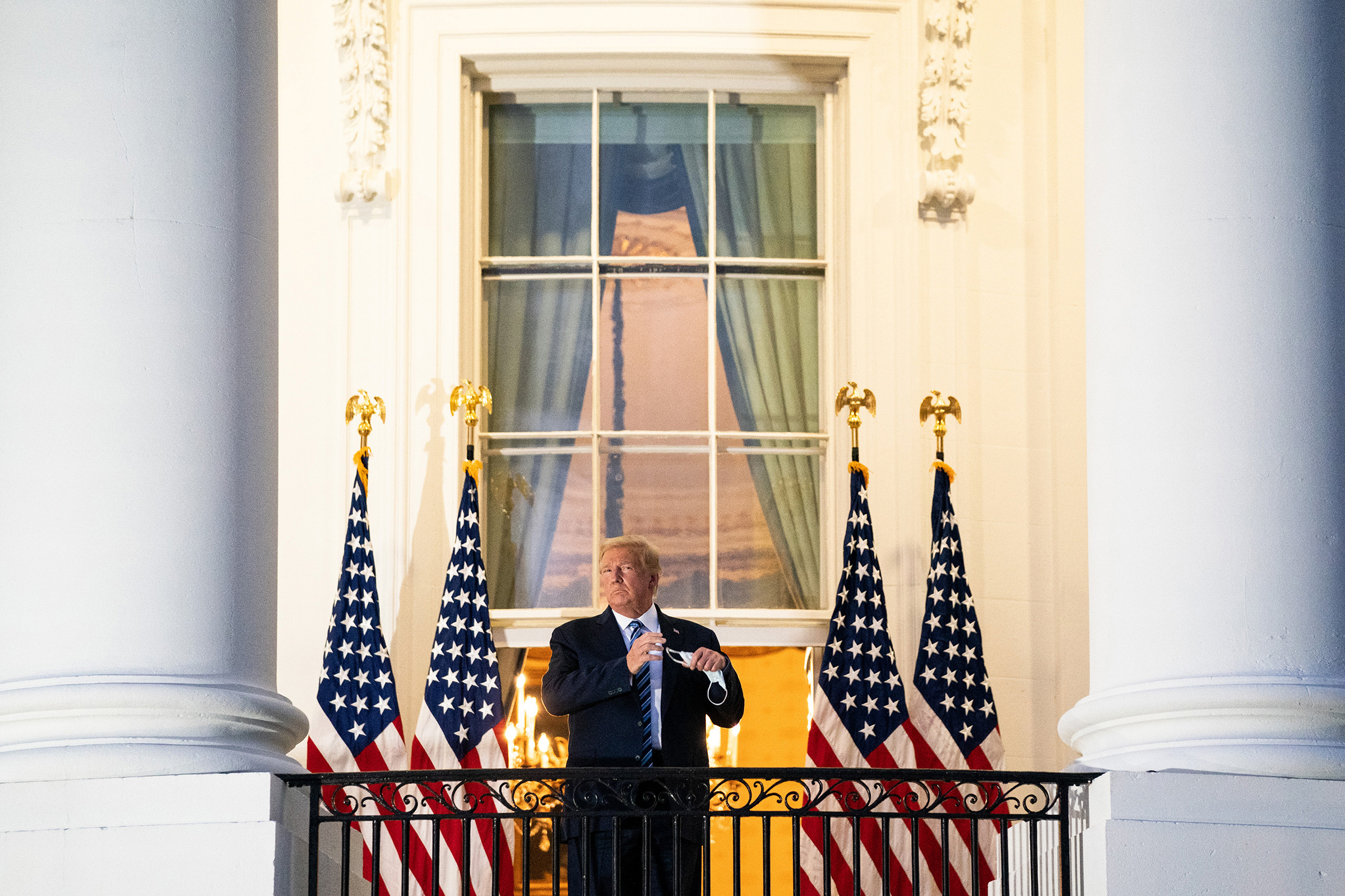 President Trump stages a theatrical return to the White House on Oct. 5 after three days of hospitalization for COVID-19