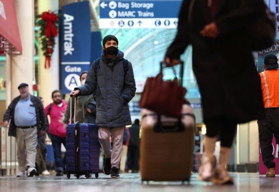 A traveler wearing a mask to protect against COVID-19