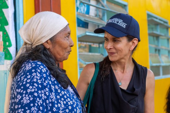 Velásquez, right, with a community leader at the Tepishi Talatshi school in 2023.