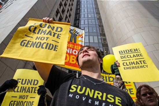 Youth from the Sunrise Movement participate in a climate protest outside of President Joe Biden’s 2024 campaign headquarters in Wilmington, Del., on Feb. 12, 2024.