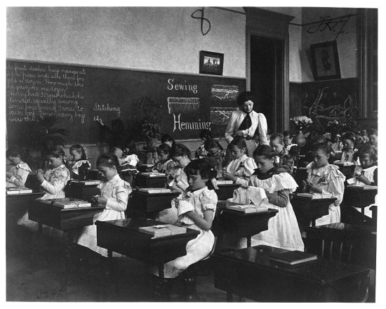 Elementary School Girls Learning Sewing