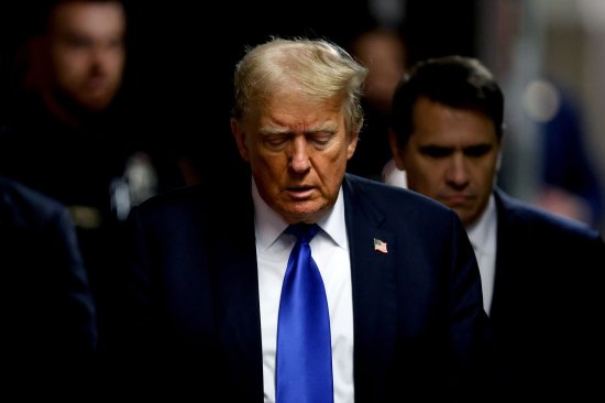 Former U.S. President Donald Trump, center, and attorney Todd Blanche, center right, arrive at Manhattan criminal court in New York City, on May 30, 2024.