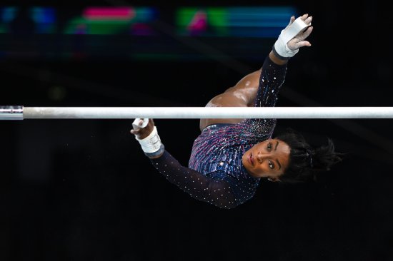 Simone Biles performs her uneven bars routine