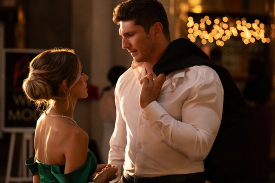 A scene from Christmas in the Spotlight, the Lifetime Christmas movie inspired by Taylor Swift's and Travis Kelce's romance.